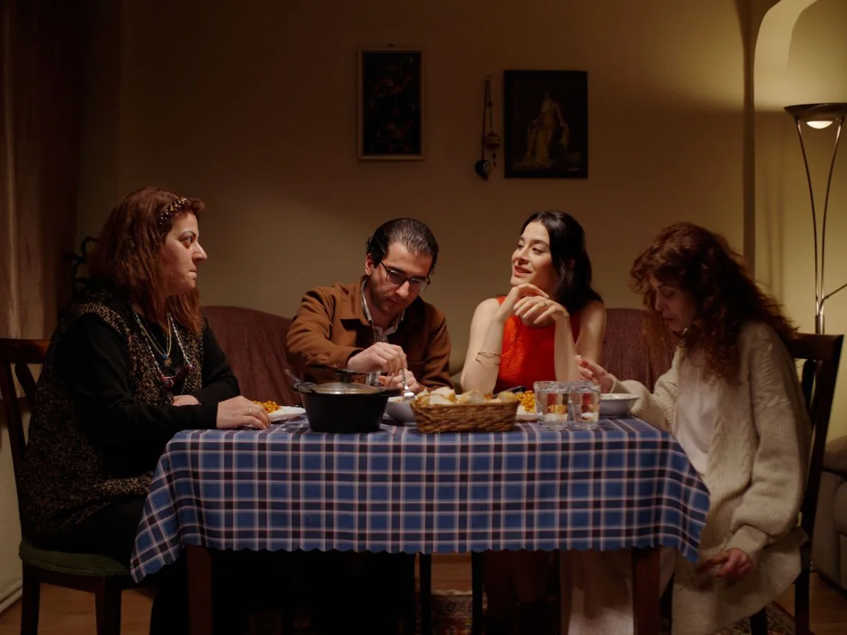 Four people sharing a cozy evening meal around a table
